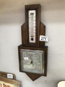 A 1930's oak aneroid barometer