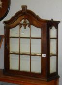 A wall mounting display cabinet.