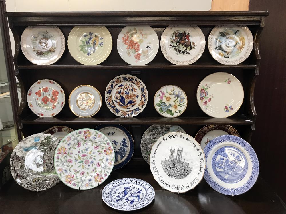 A large collection of collectors plates