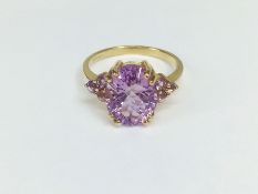 A 9ct gold and amethyst ring (hall marked GTV, Birmingham 2005), size M half.