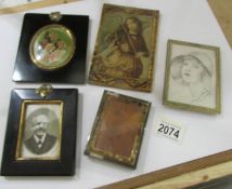 A hall marked silver photo frame and 4 small old pictures in frames.