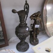 An old metal ewer and an old French figure.