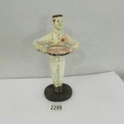 A vintage cast iron Coca Cola waiter figure.