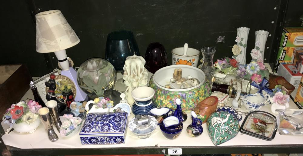 A large shelf of pottery,