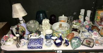 A large shelf of pottery,