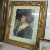 A framed and glazed portrait of a lady.