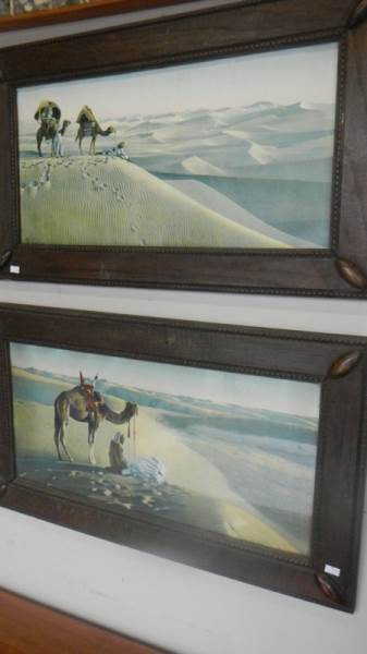 A pair of oak framed desert scenes.
