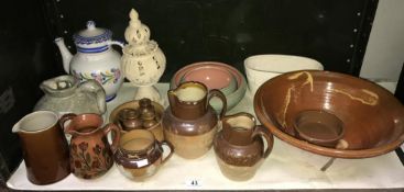 A quantity of stoneware jugs, bowls etc.