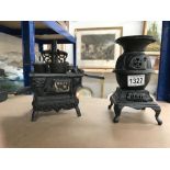 2 miniature cast iron display cooking range and a pot belly stove