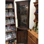 A darkwood stained astragal glazed corner cupboard A/F