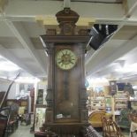 A mahogany wall clock.