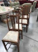2 carver chairs and a pair of matching dining chairs