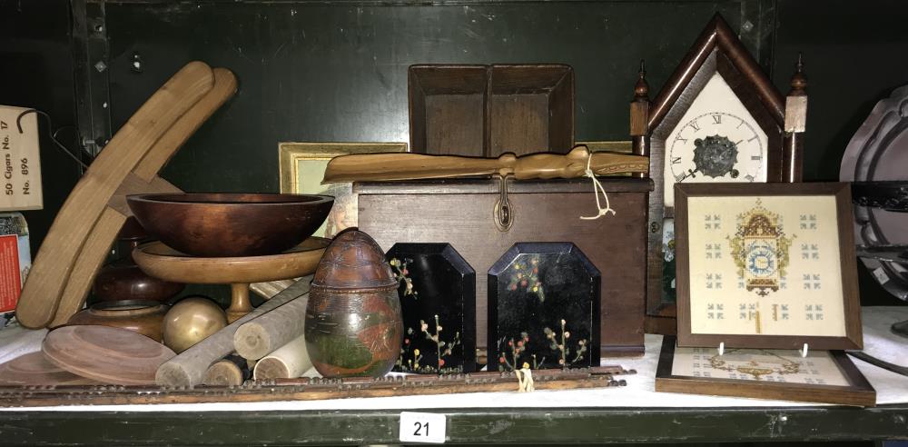 A shelf of wooden items including American gingerbread clock, cutlery tray etc.