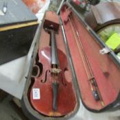 A Victorian Stradivarius copy violin with bow and case.