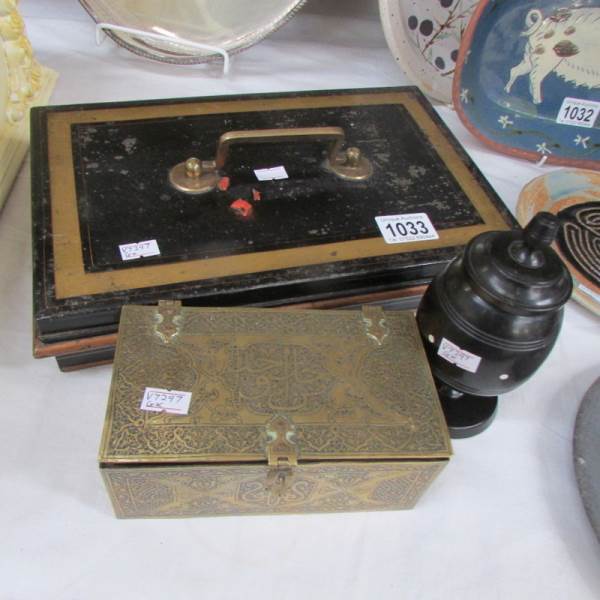 A large tin money box, a brass trinket box and a wooden trinket pot.