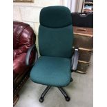 A green fabric office chair