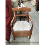 A 1930's mahogany commode / carver chair