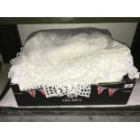 A box of linen crocheted throws