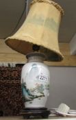 A mid 20th century Chinese vase converted to a table lamp with shade.