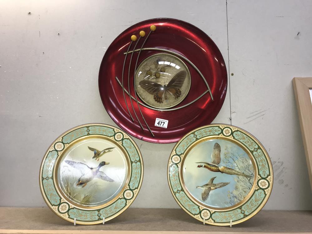 A retro metal wall plaque and a pair of lacquered wall plaques depicting birds