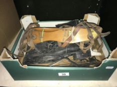 A box of ice skates, blades etc.