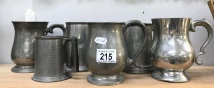 A quantity of pewter tankards