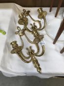 A pair of ormulu style brass wall sconce candlesticks