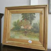 An H. Yeen-King oil on canvas laid on board entitled 'The Drinking Pool by A Tudor Cottage', framed.