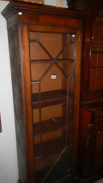 A mid 20th century slim mahogany display cabinet.