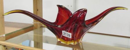 A red studio glass bowl.