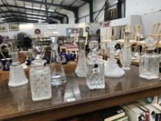 A quantity of decanters etc.