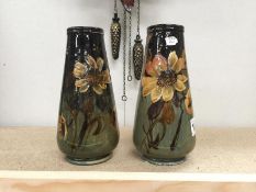 A pair of 19th C hand painted floral vases