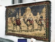 A large fabric wall hanging of camels