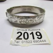 A silver bangle, approximately 35 grams.