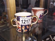 A Royal Crown Derby loving cup and an oriental tea cup