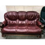 An oak framed 3 seater leather settee