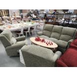 A 3 seater sofa and 2 matching armchairs