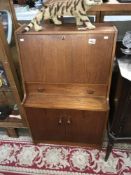 A vintage Remploy teak bureau
