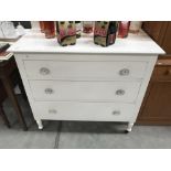 A white painted oak chest of drawers