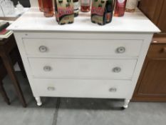 A white painted oak chest of drawers