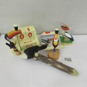 A Guinness perpetual calendar and other Guinness toucan items.