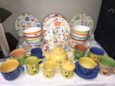 A quantity of kitchen decorated dinner ware etc.