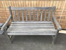 A wooden 2 seater garden bench