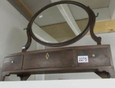 A Victorian mahogany toilet mirror with drawers.