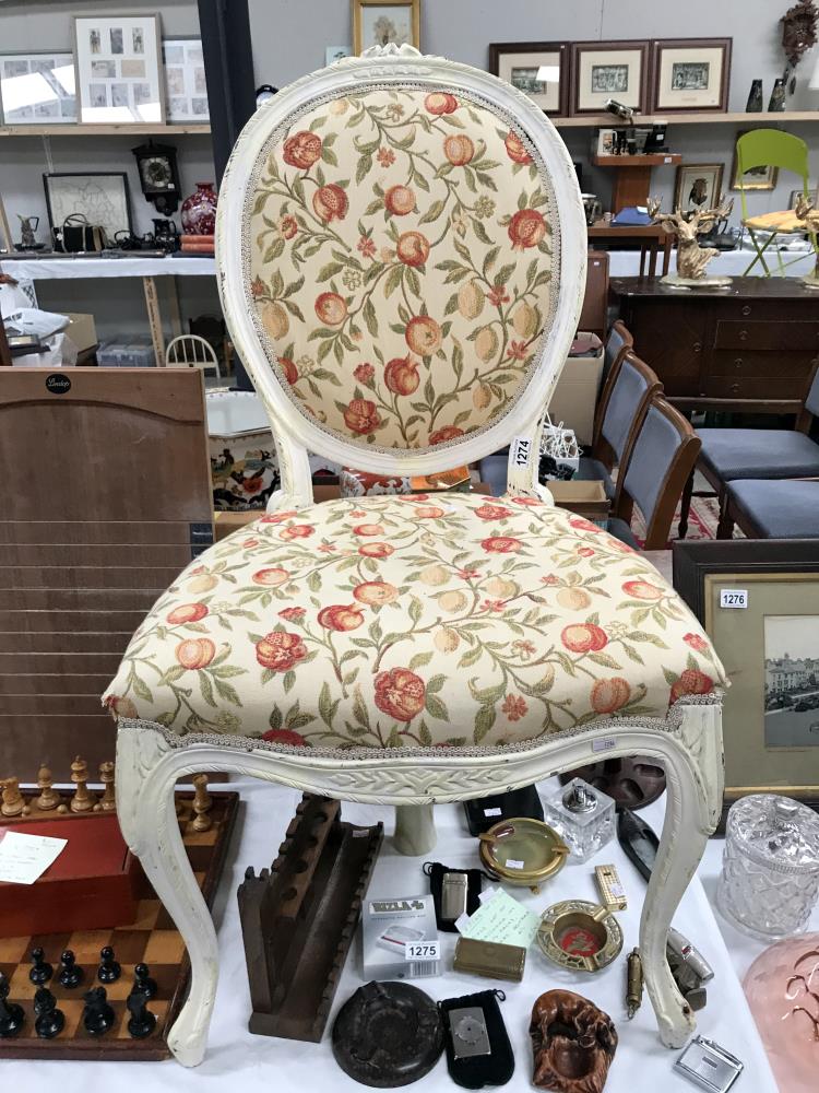 A fruit fabric covered painted balloon back chair