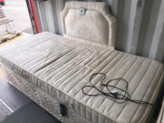 A single mattress and electric bed base with matching head board