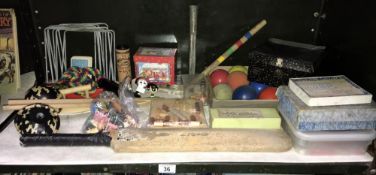 A shelf of old games including crocket, farm animals etc.