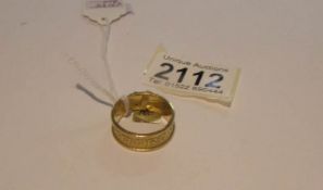 An 18ct gold Gaelic/Celtic wedding ring (hall mark possibly London 2002), approximately 10 grams,