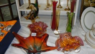 A mixed lot of coloured glass vases and bowls.