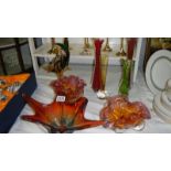 A mixed lot of coloured glass vases and bowls.